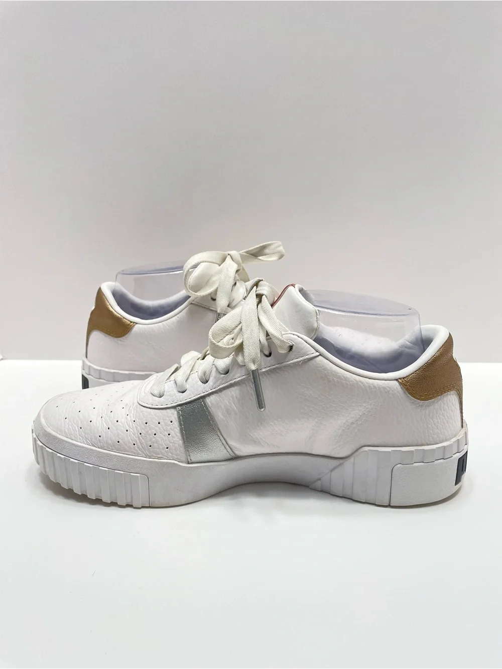 Women’s 7.5 Puma Cali Hacked White with gold and silver accents